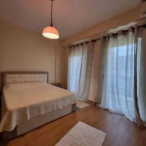 Family In Center Of Apartment